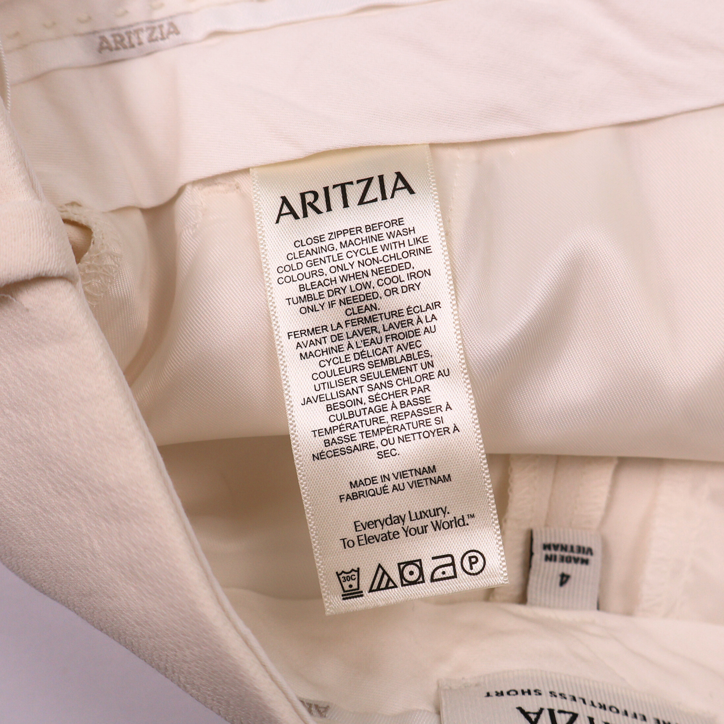 Aritzia High-Waisted Tailored Shorts – Size 4 | Neutral Pleated Dress Shorts